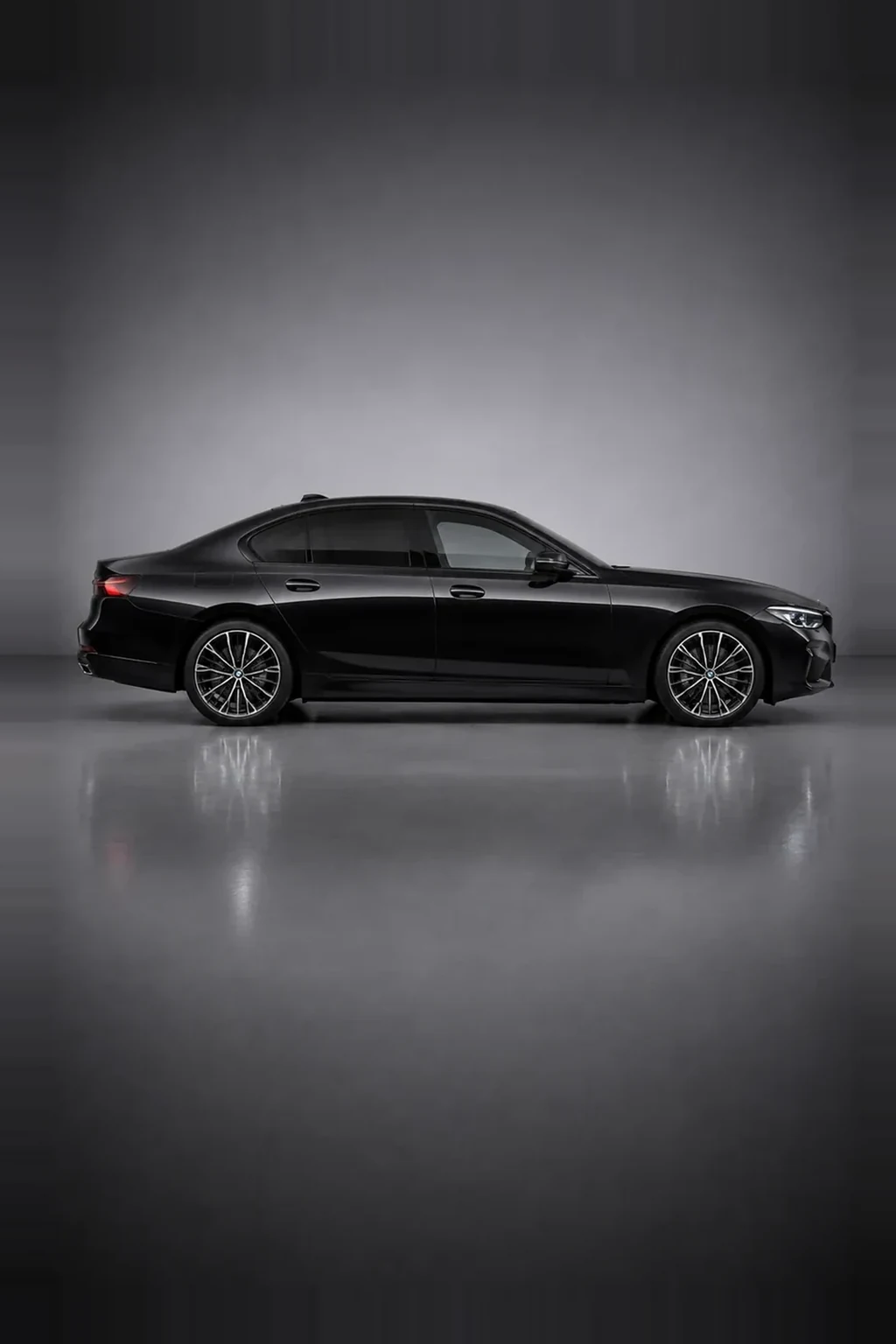 BMW 530e plug-in hybrid executive saloon in black, side profile, studio lit