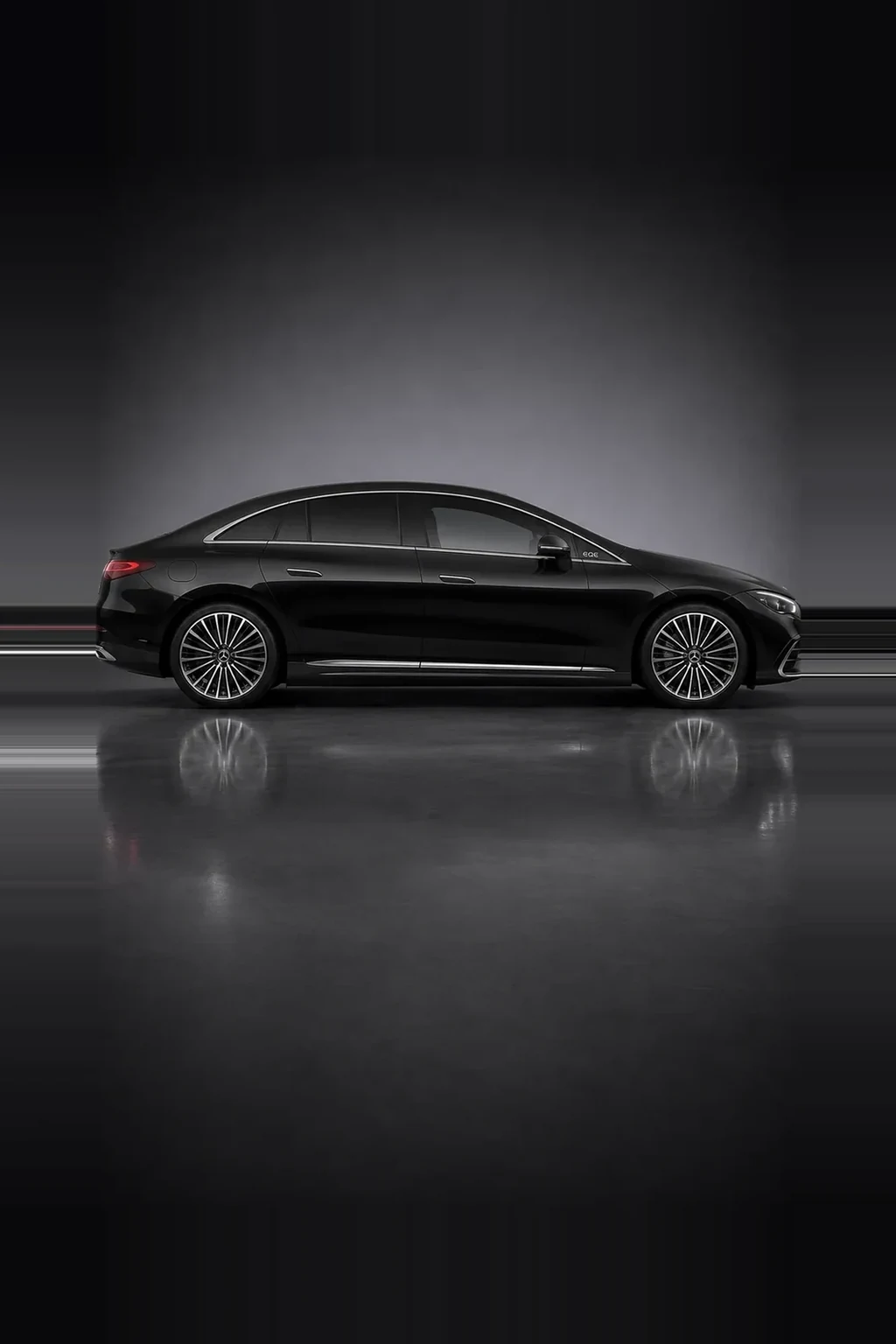 Mercedes-Benz EQE electric saloon in black, side profile, studio lit