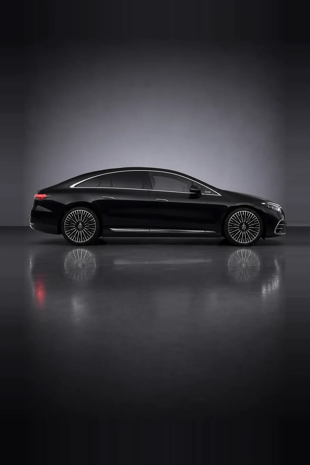 Mercedes-Benz EQS electric saloon in black, side profile, studio lit
