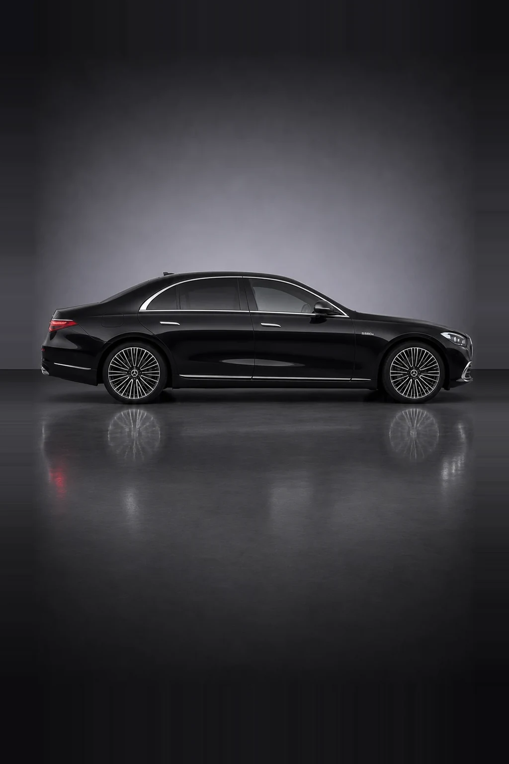 Mercedes-Benz S580Le long wheelbase saloon in black, side profile, studio lit
